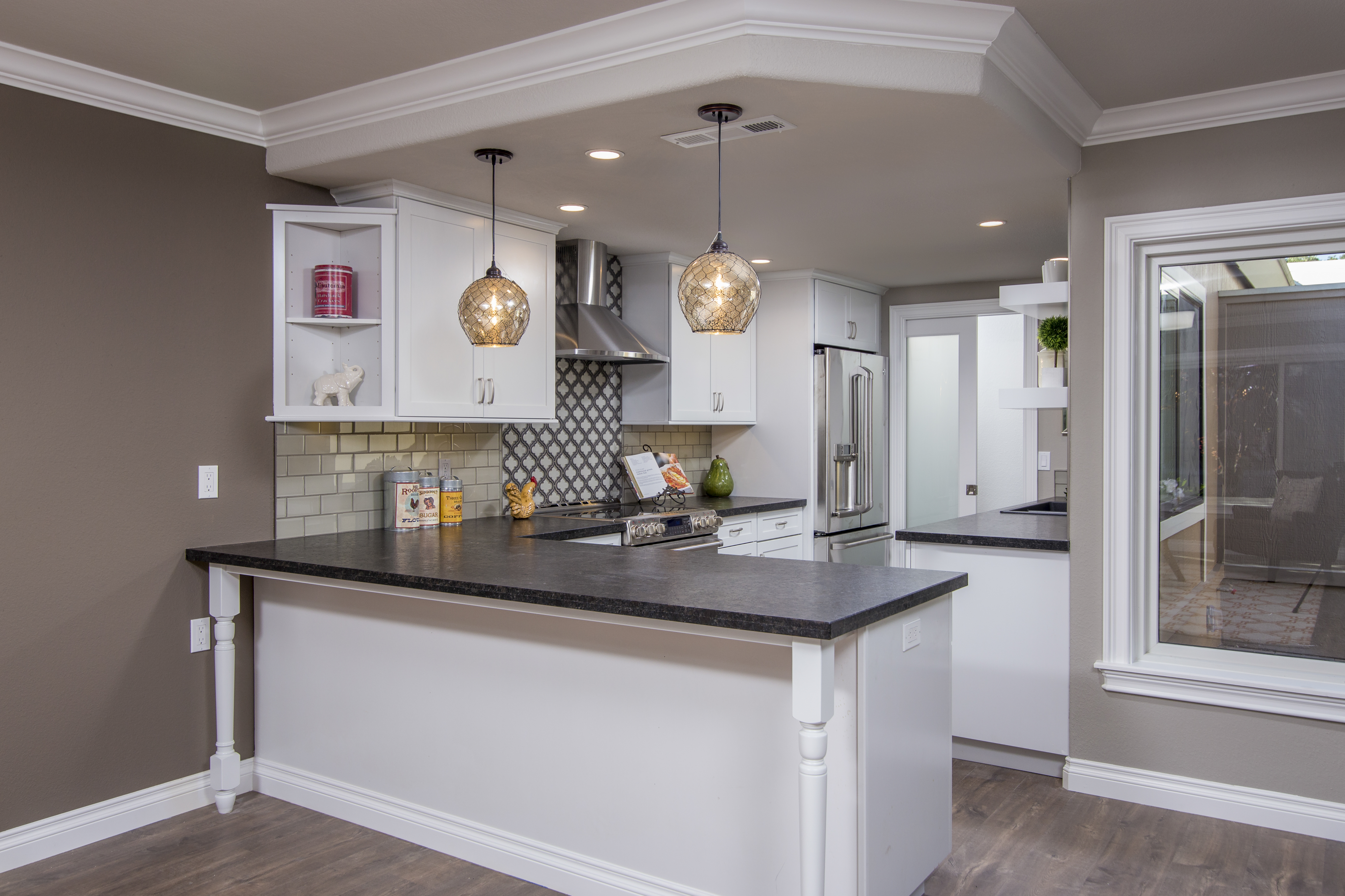 kitchen peninsula, pendant lights and custom molding
