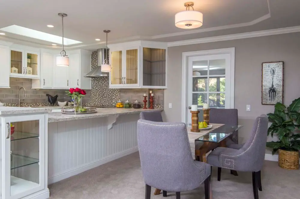 Condo kitchen peninsula creating open concept connection between kitchen and dining area without removing structural walls