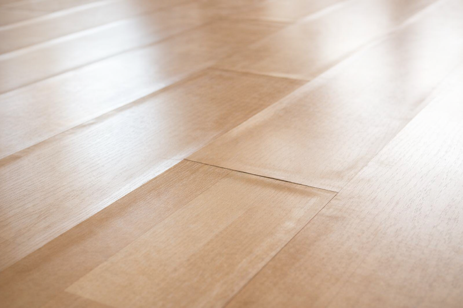 Laminate floor panels lifting and separating due to moisture damage