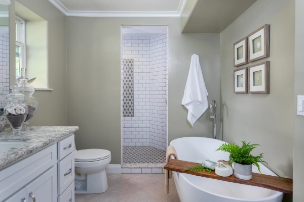 Luxury bathroom remodel featuring a freestanding soaking tub, walk-in subway tile shower, custom vanity with quartz countertop, and modern finishes.