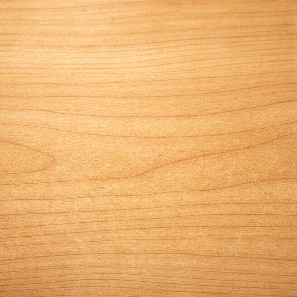 Close-up of birch wood grain showing fine, subtle texture and light coloring