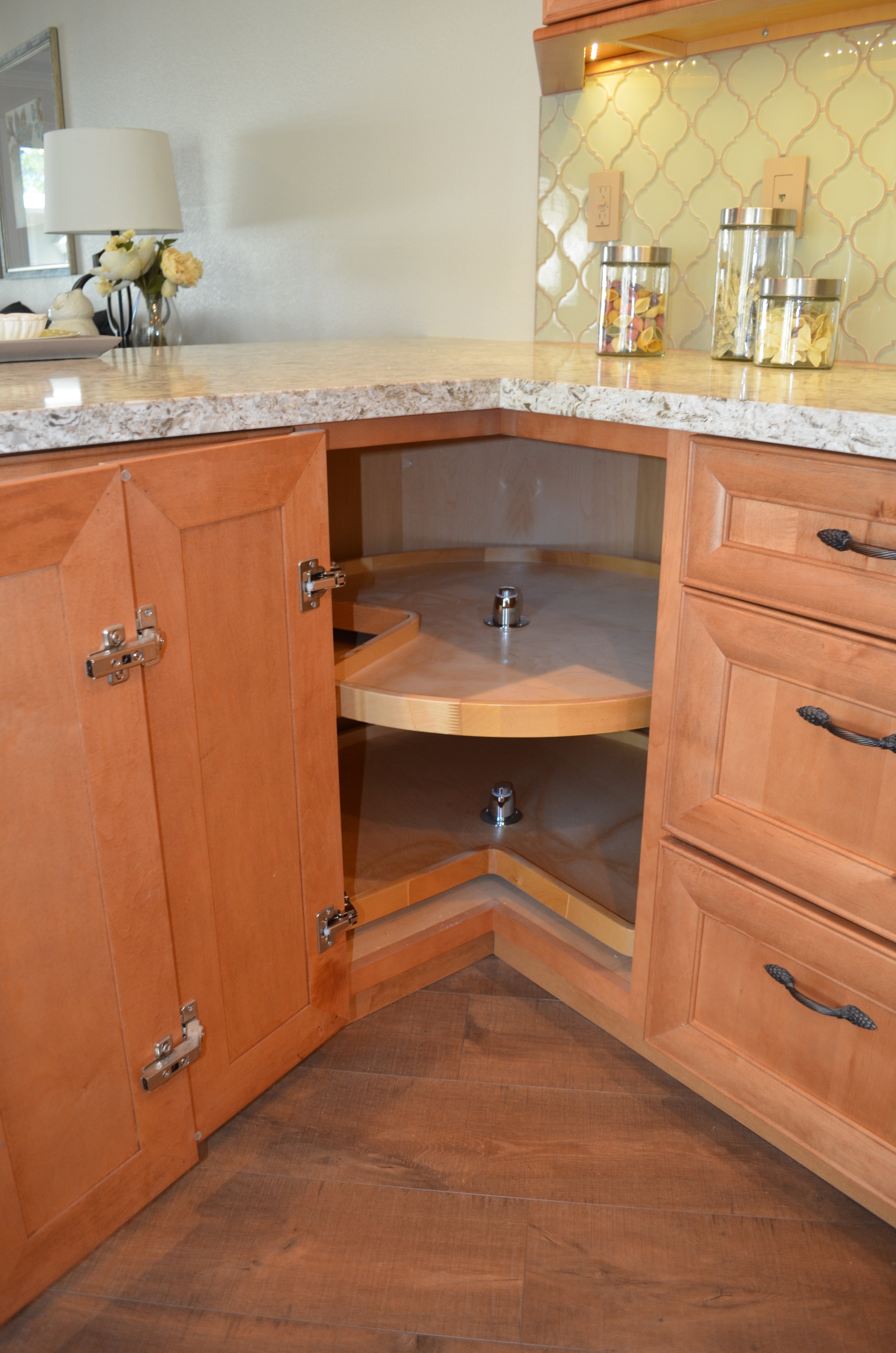 Corner kitchen cabinet with lazy Susan organizer for efficient storage and easy access.