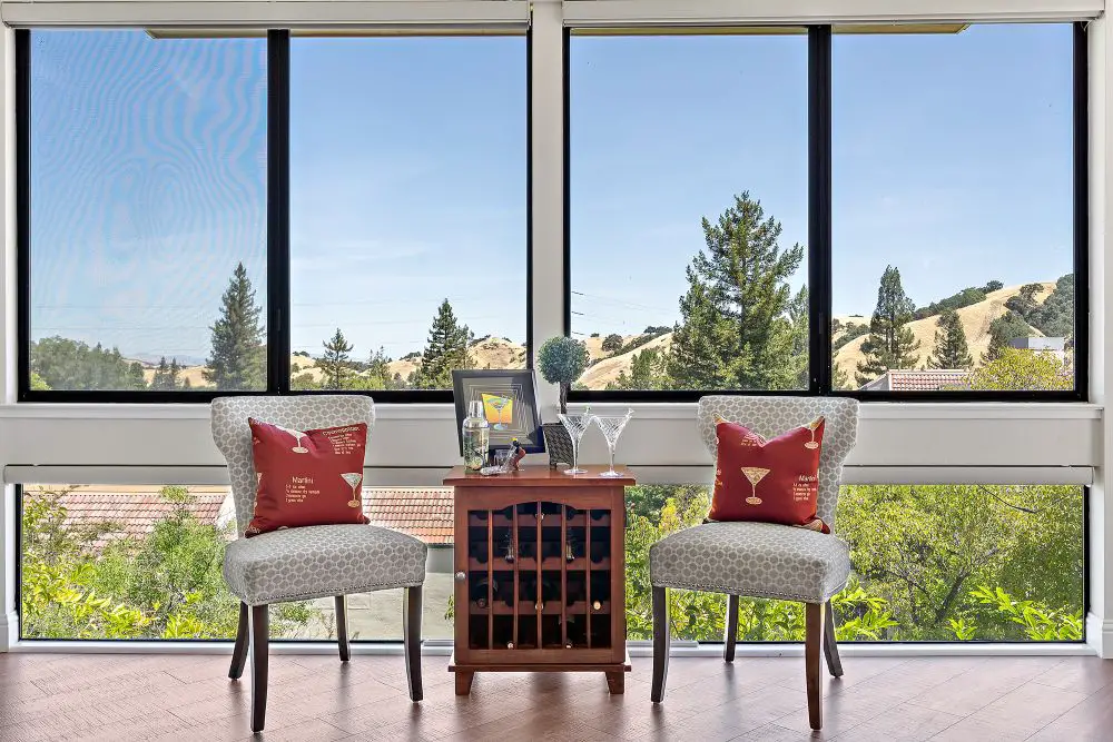 Large picture windows with natural light and hillside views in East Bay home