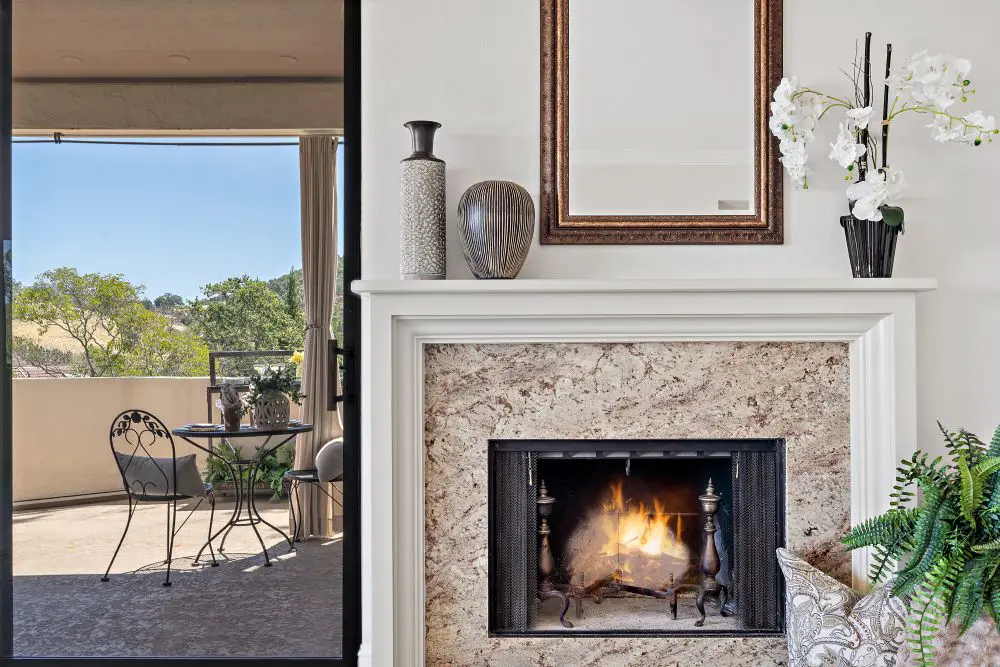 Lafayette living room with soft neutral paint, fireplace, and open sliding door to outdoor patio