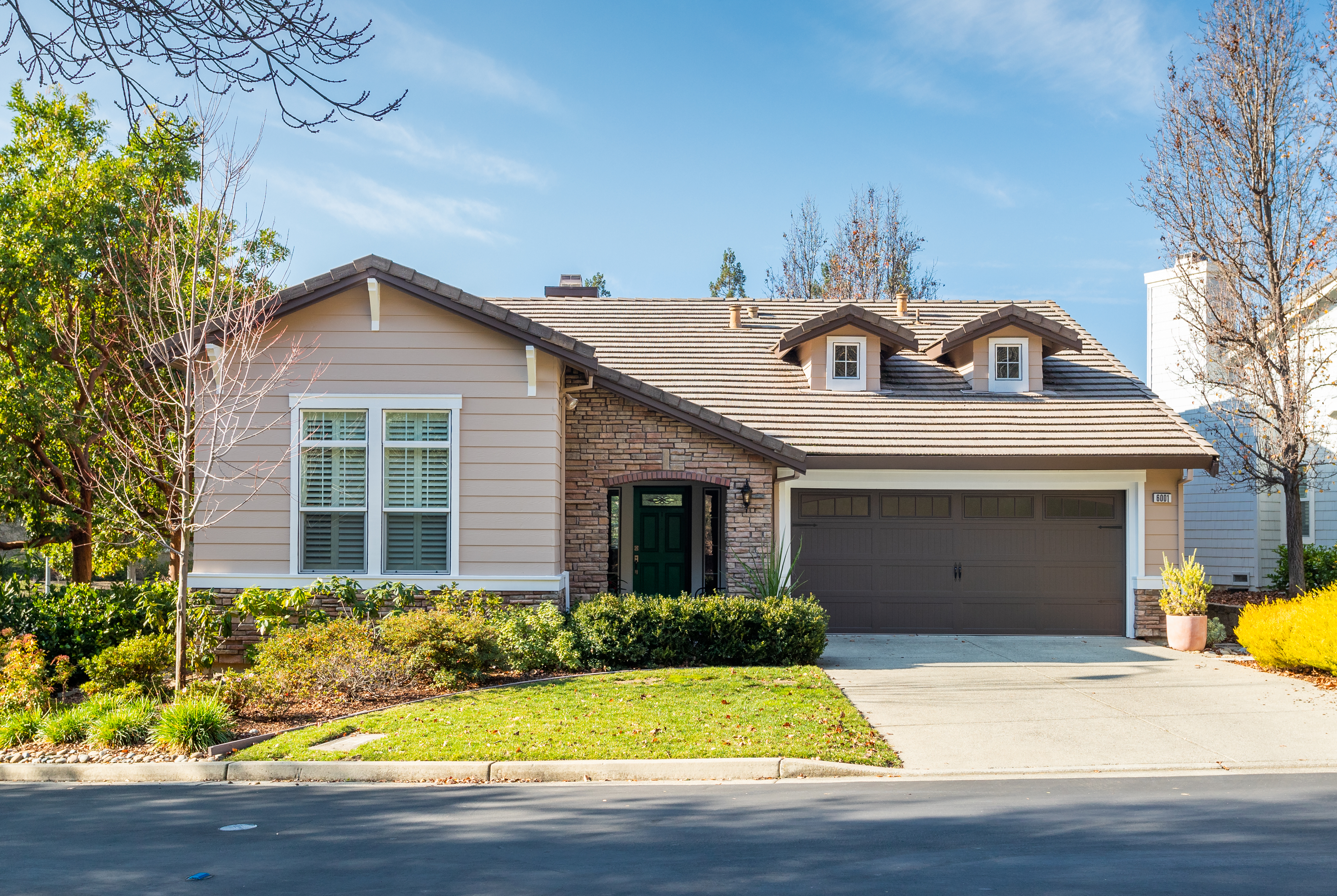Rossmoor home exterior in Walnut Creek with garage, landscaped yard, and front entry