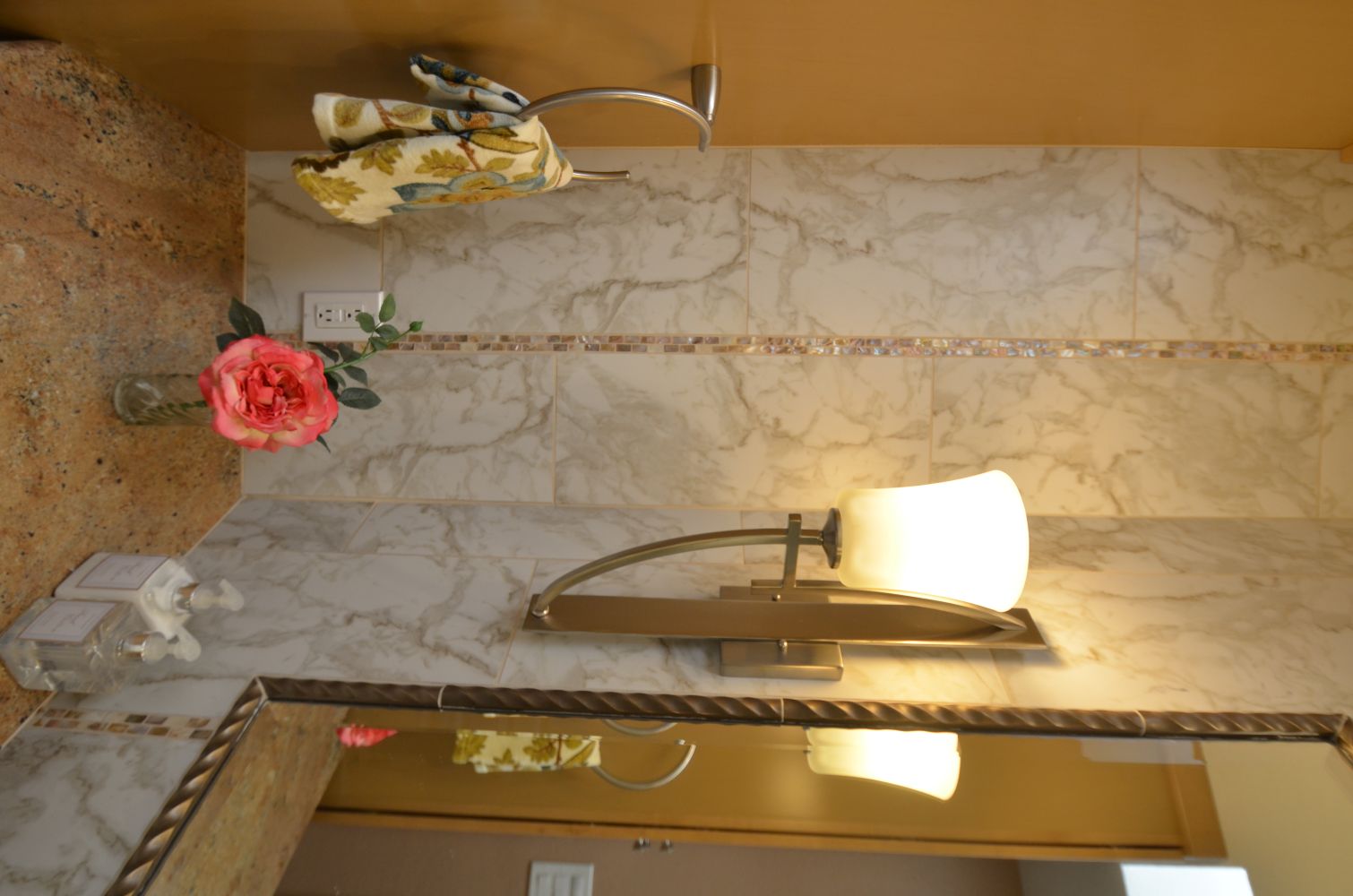 Bathroom with budget-friendly tile accent wall and updated vanity lighting in Walnut Creek