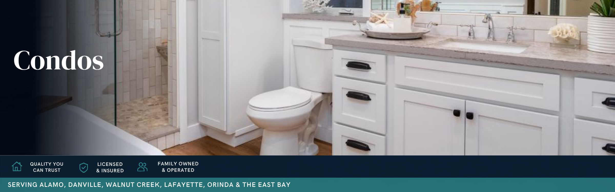 Modern condominium bathroom remodel featuring a white shaker vanity, quartz countertop, walk-in glass shower, and contemporary finishes by Toupin Construction.
