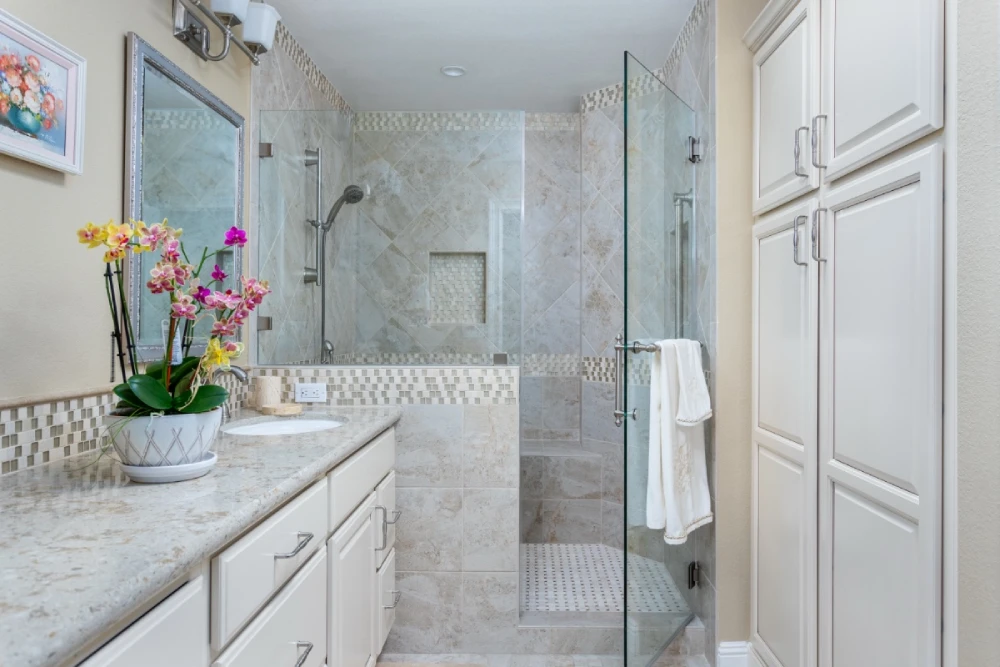 Classic cream cabinetry and tiled bathroom remodel in Rossmoor
