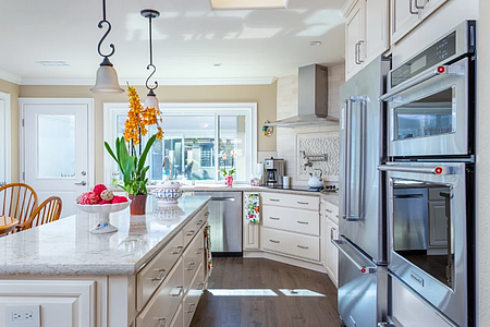 Classic cream cabinetry and tiled bathroom remodel in Rossmoor