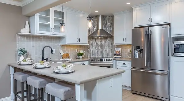 White kitchen with large island, pendant lights and stainless appliances in Rossmoor, Walnut Creek, CA. 1321 Golden Rain Remodel |Toupin Construction